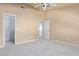 Light and airy bedroom with a large closet and view of hallway at 6970 W Morning Dove Dr, Glendale, AZ 85308