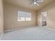 Bedroom with ceiling fan, window blinds, and access to bathroom at 6970 W Morning Dove Dr, Glendale, AZ 85308