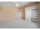 Spacious bedroom with walk-in closet and additional doors at 6970 W Morning Dove Dr, Glendale, AZ 85308