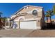 Two-story house with a two-car garage and desert landscaping at 6970 W Morning Dove Dr, Glendale, AZ 85308