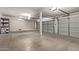 Spacious garage with ample storage shelving at 6970 W Morning Dove Dr, Glendale, AZ 85308