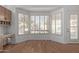 Kitchen nook with bay window and wood floors at 6970 W Morning Dove Dr, Glendale, AZ 85308