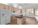 Kitchen with island, hardwood floors and breakfast nook at 6970 W Morning Dove Dr, Glendale, AZ 85308