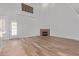 Living room with hardwood floors, fireplace, and French doors at 6970 W Morning Dove Dr, Glendale, AZ 85308