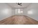 Bright living room with hardwood floors and large windows at 6970 W Morning Dove Dr, Glendale, AZ 85308