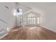 Bright living room with hardwood floors, high ceilings, and a chandelier at 6970 W Morning Dove Dr, Glendale, AZ 85308