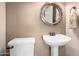 Small bathroom with a pedestal sink and toilet at 7021 E Earll Dr # 213, Scottsdale, AZ 85251