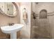 Stylish bathroom with a pedestal sink and glass shower at 7021 E Earll Dr # 213, Scottsdale, AZ 85251