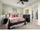 Bright bedroom featuring a queen bed and ensuite access at 7021 E Earll Dr # 213, Scottsdale, AZ 85251