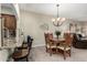 Small dining area with round table and four chairs, near kitchen at 7021 E Earll Dr # 213, Scottsdale, AZ 85251