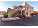 Two-story building exterior with stairs and attached garage at 7021 E Earll Dr # 213, Scottsdale, AZ 85251