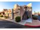 Building exterior with stairs, garage, and landscaping at 7021 E Earll Dr # 213, Scottsdale, AZ 85251