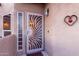 Inviting front entrance with decorative security door at 7021 E Earll Dr # 213, Scottsdale, AZ 85251