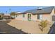 Large backyard with gravel, additional building, and patio area at 7215 W Mclellan Rd, Glendale, AZ 85303