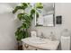 Small bathroom with pedestal sink and decorative mirror at 7215 W Mclellan Rd, Glendale, AZ 85303