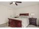 Bright bedroom featuring a wooden sleigh bed and ceiling fan at 7215 W Mclellan Rd, Glendale, AZ 85303