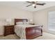 Spacious bedroom with a wooden sleigh bed and plenty of light at 7215 W Mclellan Rd, Glendale, AZ 85303