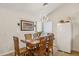 Dining area with a wood table and chairs, adjacent to the kitchen at 7215 W Mclellan Rd, Glendale, AZ 85303