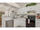 Modern kitchen featuring stainless steel appliances and white cabinetry at 7215 W Mclellan Rd, Glendale, AZ 85303