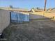 Backyard with storage shed and a dog statue at 7940 W Avalon Dr, Phoenix, AZ 85033