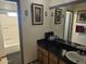 Clean bathroom with granite vanity and a bathtub at 7940 W Avalon Dr, Phoenix, AZ 85033