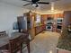 Spacious kitchen featuring stainless steel appliances, granite countertops, and tile flooring at 7940 W Avalon Dr, Phoenix, AZ 85033