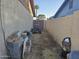 Side yard with gate, small go-kart, and cinder blocks at 7940 W Avalon Dr, Phoenix, AZ 85033