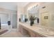 Elegant bathroom with double sinks, marble vanity, and shower at 8245 E Jenan Dr, Scottsdale, AZ 85260