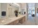 Bathroom with double sinks and view of bedroom at 8245 E Jenan Dr, Scottsdale, AZ 85260