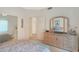 Bedroom with dresser and mirrored closet, access to another room at 8245 E Jenan Dr, Scottsdale, AZ 85260