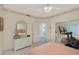 Bedroom with mirrored closet and dresser, offering access to another room at 8245 E Jenan Dr, Scottsdale, AZ 85260