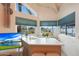 Breakfast bar with view of backyard and pool, perfect for casual dining at 8245 E Jenan Dr, Scottsdale, AZ 85260