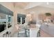 Bright dining area with glass-top table and seating for four at 8245 E Jenan Dr, Scottsdale, AZ 85260