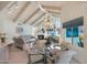 Open dining area with glass table and seating for four, adjacent to the living room at 8245 E Jenan Dr, Scottsdale, AZ 85260