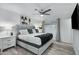 Main bedroom with gray platform bed and white bedding at 8314 E Clarendon Ave, Scottsdale, AZ 85251