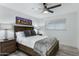 Bedroom with wooden bed frame and gray blanket at 8314 E Clarendon Ave, Scottsdale, AZ 85251