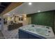 Hot tub on a patio with seating area and lush greenery at 8314 E Clarendon Ave, Scottsdale, AZ 85251