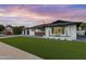 Modern house with artificial turf lawn at 8314 E Clarendon Ave, Scottsdale, AZ 85251