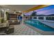 Inviting backyard oasis featuring a sparkling pool, hot tub, and patio area at 8314 E Clarendon Ave, Scottsdale, AZ 85251