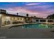 Stunning pool and patio area with modern finishes and string lights at 8314 E Clarendon Ave, Scottsdale, AZ 85251