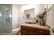 Updated bathroom with granite vanity and walk-in shower at 8514 E Fairmount Ave, Scottsdale, AZ 85251