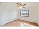 Spacious bedroom featuring wood flooring and double closets at 8514 E Fairmount Ave, Scottsdale, AZ 85251