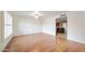 Bright dining room with hardwood floors and view into kitchen at 8514 E Fairmount Ave, Scottsdale, AZ 85251