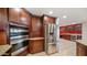 Modern kitchen featuring stainless steel double ovens and granite countertops at 8514 E Fairmount Ave, Scottsdale, AZ 85251