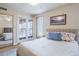 Bedroom with sliding glass doors leading to a patio at 9103 E Winchcomb Dr, Scottsdale, AZ 85260