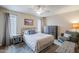 Bright bedroom with plush bed, dresser, and comfortable armchair at 9103 E Winchcomb Dr, Scottsdale, AZ 85260