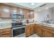 Kitchen boasts stainless steel appliances and granite countertops at 9103 E Winchcomb Dr, Scottsdale, AZ 85260