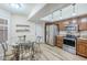 Bright kitchen with wood cabinets, stainless steel appliances, and a dining area at 9103 E Winchcomb Dr, Scottsdale, AZ 85260