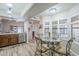 Kitchen features a dining area with bay window and wood cabinets at 9103 E Winchcomb Dr, Scottsdale, AZ 85260