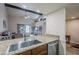 Kitchen with stainless steel sink and dishwasher, granite countertops at 9103 E Winchcomb Dr, Scottsdale, AZ 85260